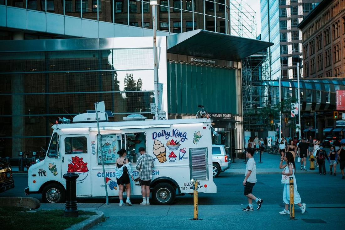 A Sprinter van collecting a group outside a Portland Street bar