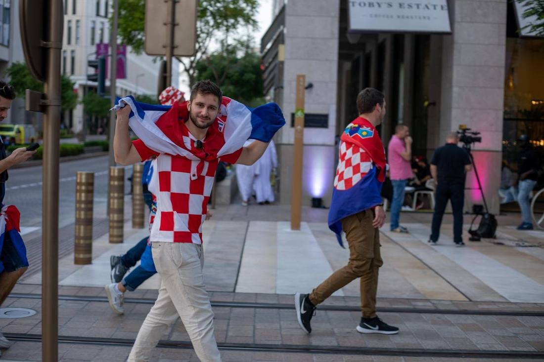 Fans walking toward Exhibition Place's screening gates on a World Cup match day