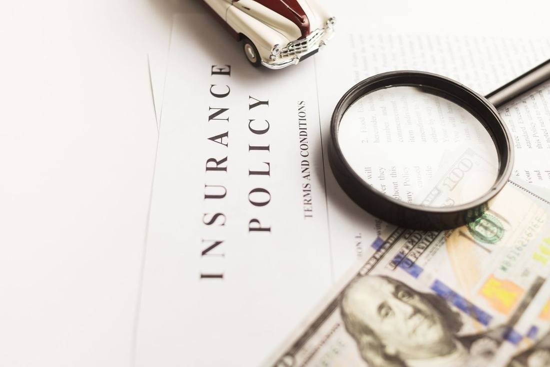 An annual vehicle inspection sticker and a certificate of insurance