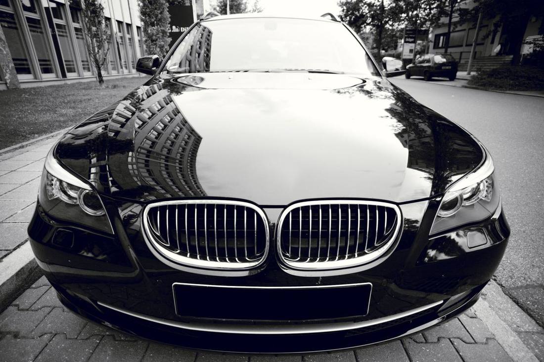 A black sedan on a wide Willowdale residential street