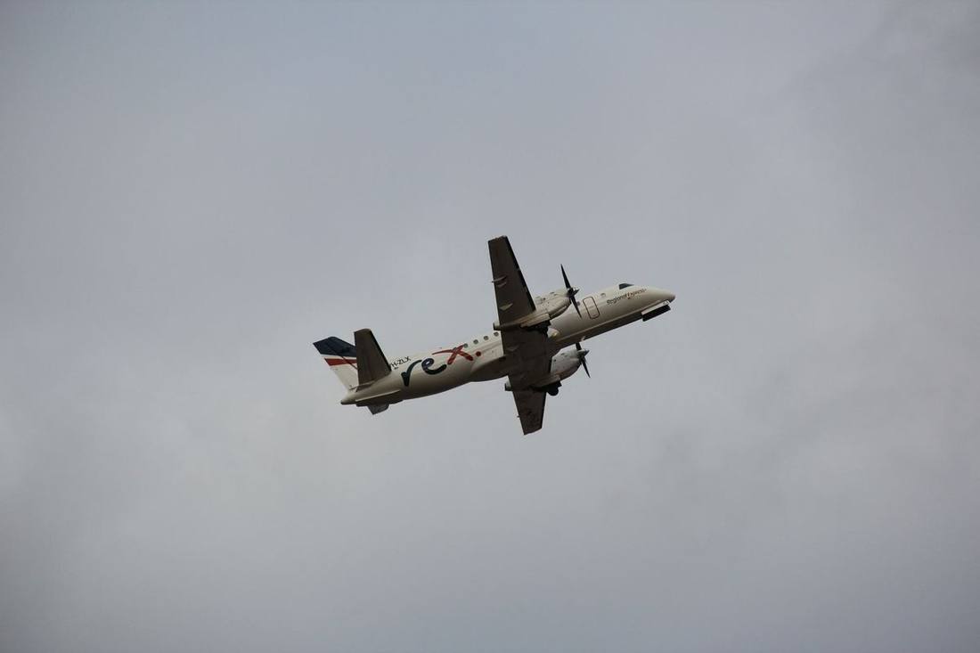 A Porter turboprop at Billy Bishop with the city behind