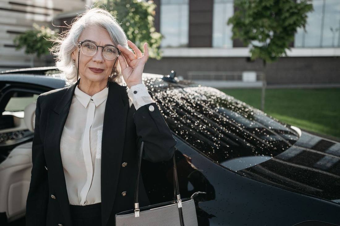 Executives entering a black SUV between meetings